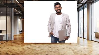 Young handsome indian hipster man holding laptop isolated on white background Wall mural